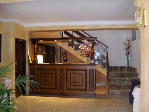 a staircase leading up to a room with a staircase at Hostal Alfonso in Cala Ratjada