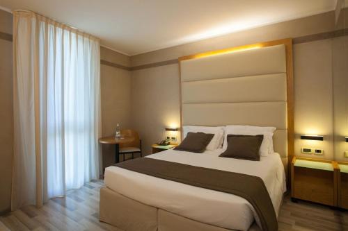 Cama o camas de una habitación en Park Hotel Ai Pini & Restaurant Ai Pini