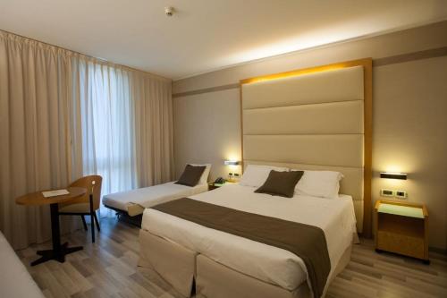 Cama o camas de una habitación en Park Hotel Ai Pini & Restaurant Ai Pini