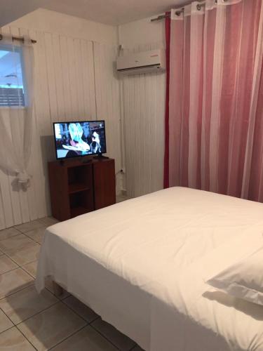 Postel nebo postele na pokoji v ubytování Location tropical