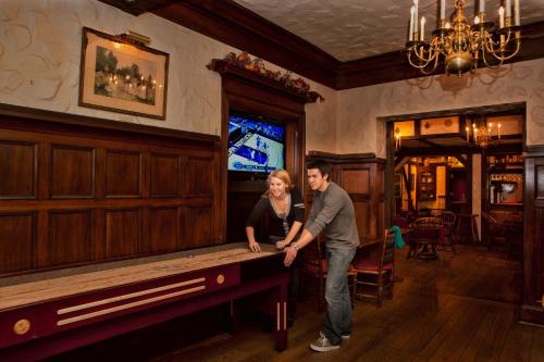a man and a woman standing next to a pool table at Hotel Amari in San Francisco