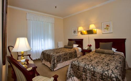 Tempat tidur dalam kamar di Hotel Amari