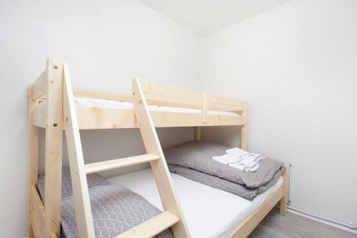 Postel nebo postele na pokoji v ubytování Nordurey Apartments
