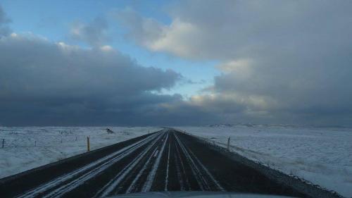 a road covered in snow with the sky in the background at Walbrzych - przytulne, nowe mieszkanie in Wałbrzych
