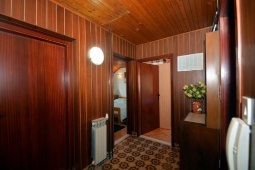 a hallway with a vase of flowers in a room at Apartment Mimica-Croatia , Omis , Center in Omiš