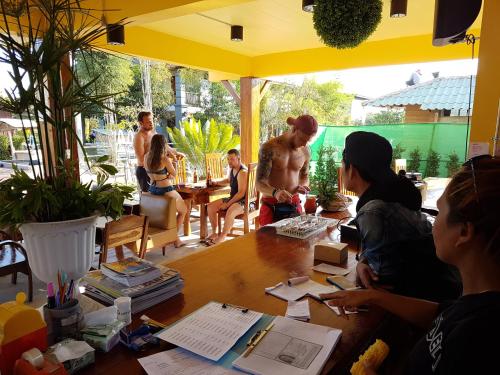 a group of people sitting around a table at Slow Life Sabaidee Pai in Pai