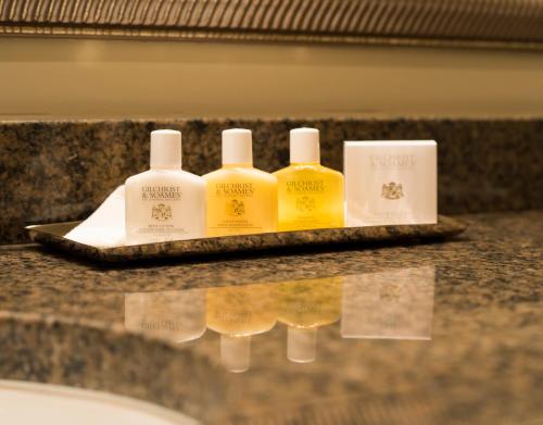 a group of three bottles of soap on a counter at Fulton Lane Inn in Charleston