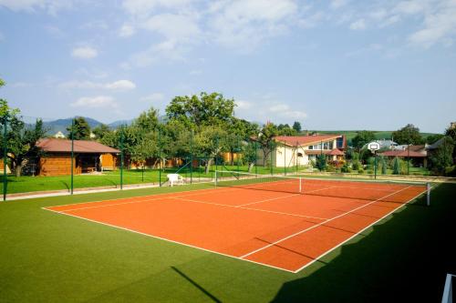 a tennis court with a net on top of it at Vila Valča in Valča