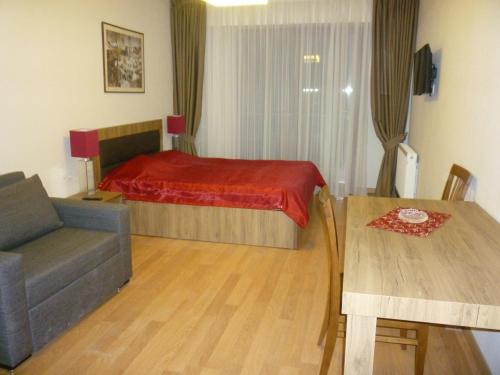 Ένα ή περισσότερα κρεβάτια σε δωμάτιο στο Gudauri Vano Apartments