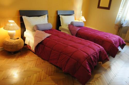 Un pat sau paturi într-o cameră la B&B Quo Vadis Arena