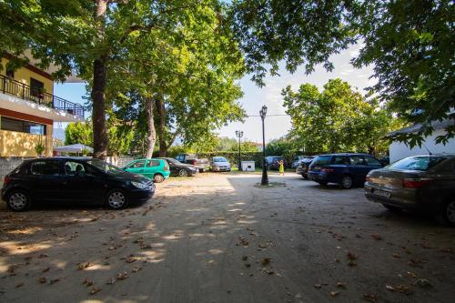 a bunch of cars parked in a parking lot at Armiriki Rooms in Vrasná