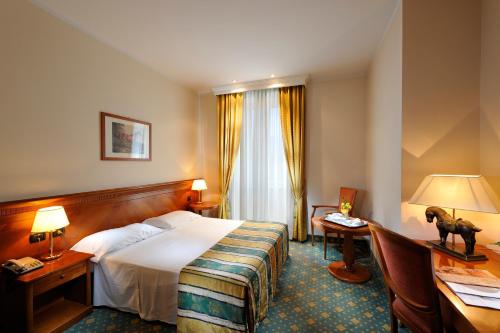 Postel nebo postele na pokoji v ubytování Hotel Eden