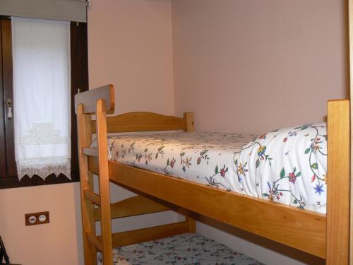 a bedroom with a bunk bed and a window at Gauach in Bossost