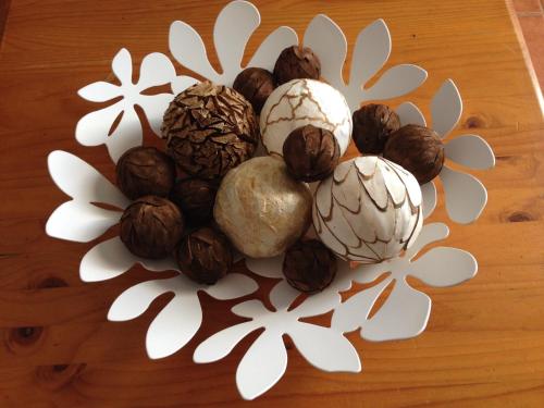 a group of nuts and seeds on a table at Apartamento Inma in Famara
