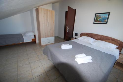 Posteľ alebo postele v izbe v ubytovaní Batinic Apartmani