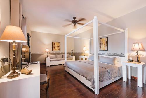 Säng eller sängar i ett rum på Hotel Hacienda Mérida