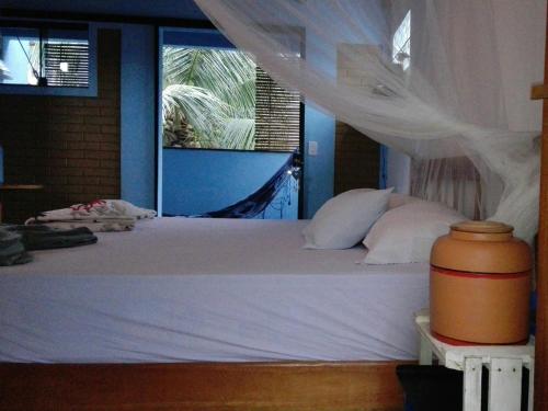 Uma cama ou camas num quarto em Casa Blanka 2010 - Eco Surf Guest House