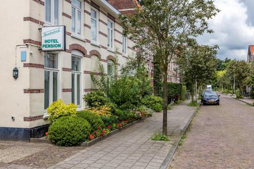 a hotel room with a sign on the side of a building at Hotel Randenbroek in Amersfoort