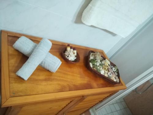a wooden table with a cross and some food on it at Quiet spacious apartment in Nafplio in Nafplio