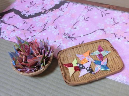 two baskets filled with colorful paper and a plant at Takayama Ninja House in Takayama