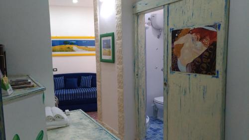 a room with a door open to a living room at Albergo Diffuso Culturart House in Agrigento
