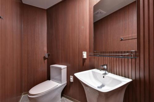 a bathroom with a toilet and a sink at Sea Moon Tourist Hotel in Incheon