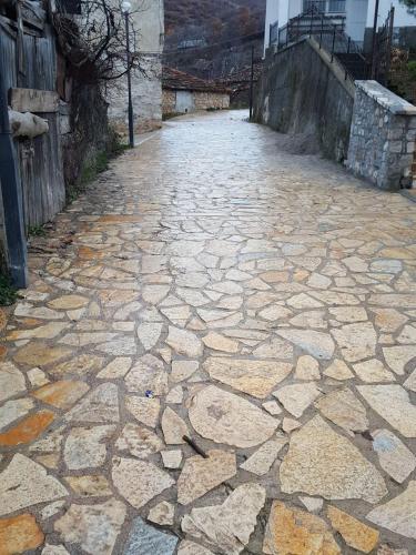 a stone walkway with a cobblestone street at Nuci's Home glass floor in Tushemisht