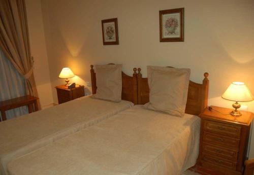 Ένα ή περισσότερα κρεβάτια σε δωμάτιο στο Hotel Jardim