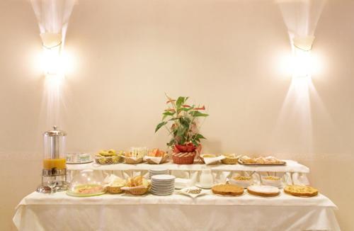 a table with several plates of food on it at Dropiluc in Druento