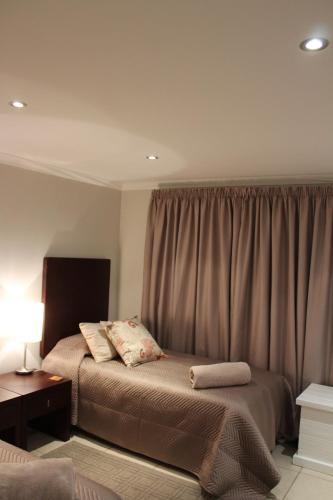 Ένα ή περισσότερα κρεβάτια σε δωμάτιο στο Seafront Apartment in Mossel Bay