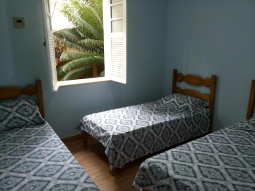Un pat sau paturi într-o cameră la Coração do Centro
