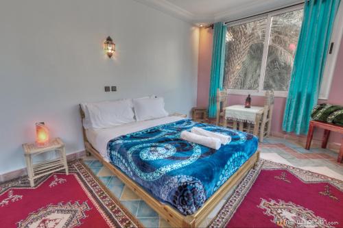 Postel nebo postele na pokoji v ubytování RIAD Camping ATLAS