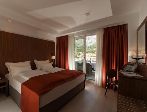Posteľ alebo postele v izbe v ubytovaní Aparthotel Miramare