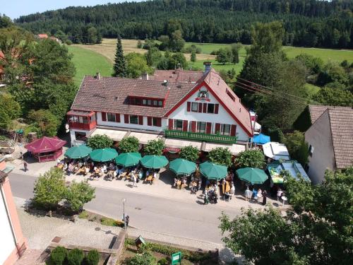 an overhead view of a building with green umbrellas at Hotel Platzhirsch in Gaggenau