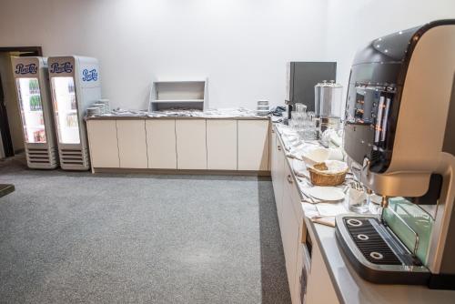 Kuchyň nebo kuchyňský kout v ubytování Restaurant & Design Hotel Noem Arch