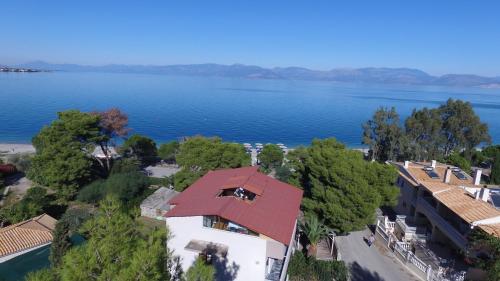 an aerial view of a house next to a lake at Stavento in Diakopto