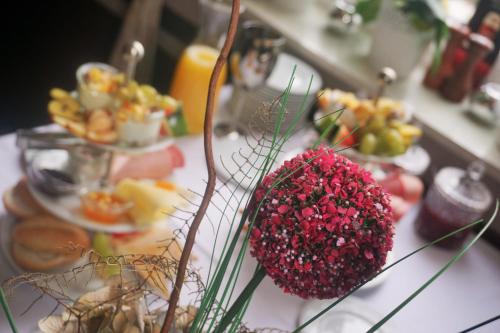 a table with a bunch of food on it at Pharos zur Seeve in Seevetal