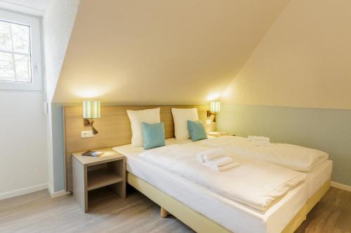Postel nebo postele na pokoji v ubytování Center Parcs Nordseeküste Bremerhaven
