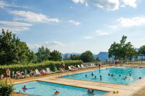 a group of people swimming in a pool at VTF Le Pigneroux in Savines