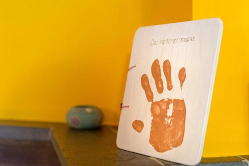 a white paper with a pawprint on it on a table at La Coberta-Lo Paller del Coc in Rialp