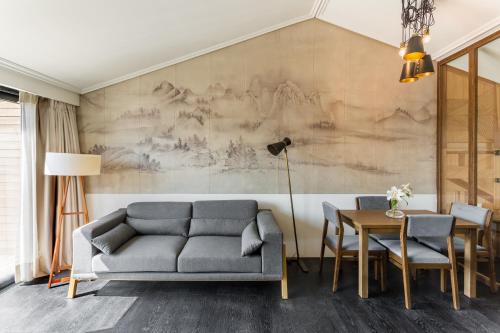 a living room with a couch and a table at Room Mate Emir, Istanbul in Istanbul