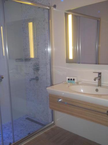 a bathroom with a shower and a sink at Blue Bay Platinum in Marmaris
