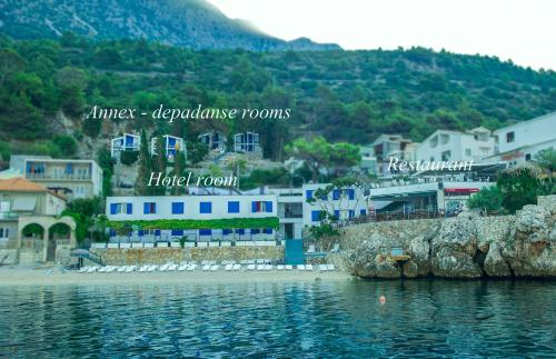 a town on the shore of a body of water at Beach Hotel in Drasnice