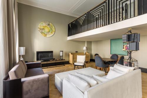 a living room with a couch and a tv at Room Mate Emir, Istanbul in Istanbul