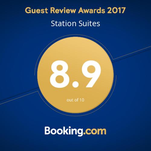 a yellow circle with the words quest review awards station suites at Station Suites in Watford