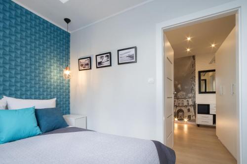 Posteľ alebo postele v izbe v ubytovaní Rajska Apartament- Gdańsk