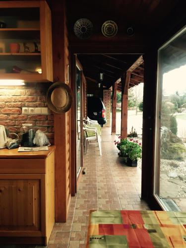 a kitchen with an open door to a patio at Vila Valča in Valča