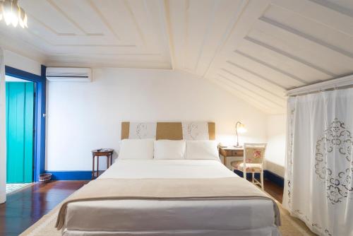 Кровать или кровати в номере Hotel Solar do Rosário