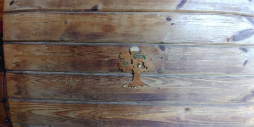 a wooden trunk with a puzzle piece on it at kinneret love sounds in Migdal