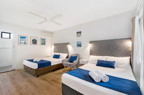 Ένα ή περισσότερα κρεβάτια σε δωμάτιο στο Beach House Motel